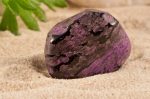 Photo collection of half-precious stones and gem stones. Here shown: the rarely Sugilite.