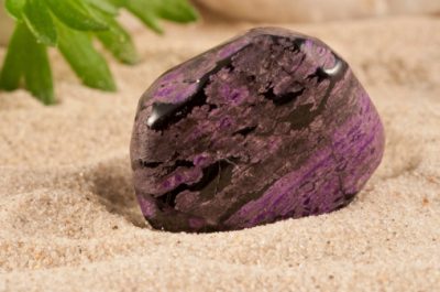 Photo collection of half-precious stones and gem stones. Here shown: the rarely Sugilite.
